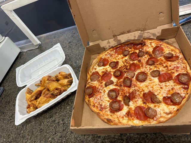 Medium 12" Pizza with One Topping & 10 Wings Special.